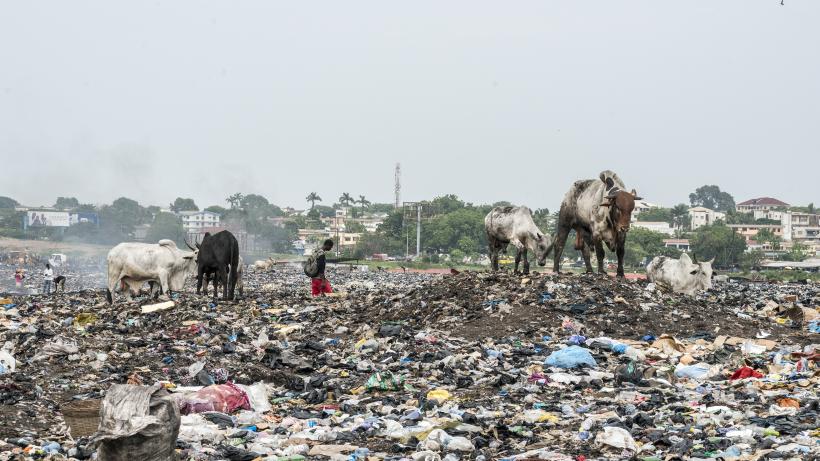 Residents recycle junk in a waste disposal dump in Accra, Ghana